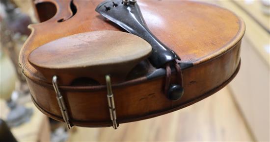 An early 20th century violin, bears label Paolo Fiorini, Taurini 1928, cased with a bow, single-piece back 36cm